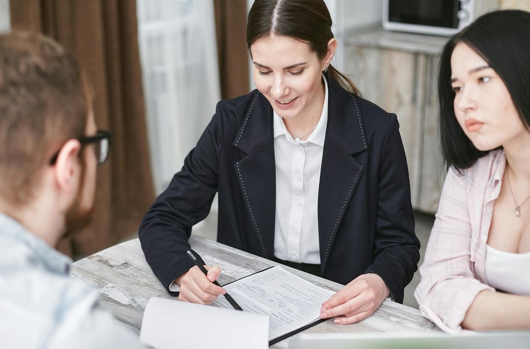CPA reviewing tax documents with business owners